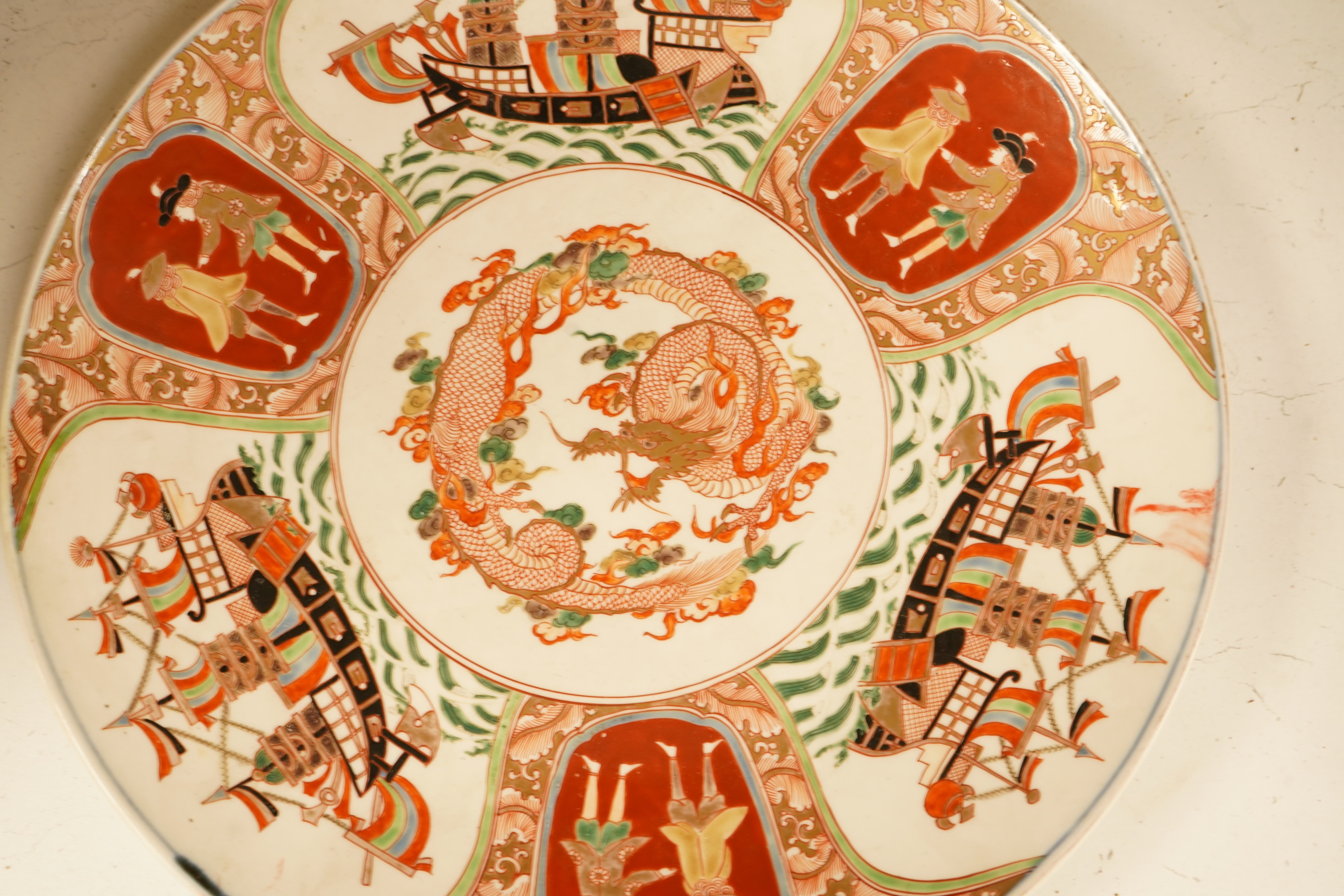 A Japanese Imari 'black ship' dish, 19th century, 36cm diameter
